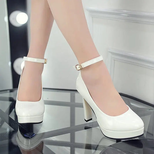 Sleek High Heels: Patent Leather Ankle Strap Pumps"